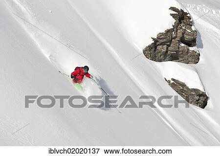 Stock Photo - "Freerider snowboarding in deep snow, North Tyrol, Austria, Europe". Fotosearch