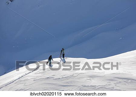 Stock Photography - "Freeriders, snowboarders walking to the slope, snowy landscape, northern Tyrol, Austria, Europe". Fotosearch
