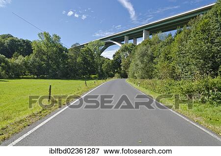 "Freeway viaduct across a green valley and a paved road, Zuschendorf, Saxony, Germany, Europe" View Large Photo Image Stock Photo - "Freeway viaduct across a green valley and a paved road, Zuschendorf, Saxony, Germany, Europe". Fotosearch