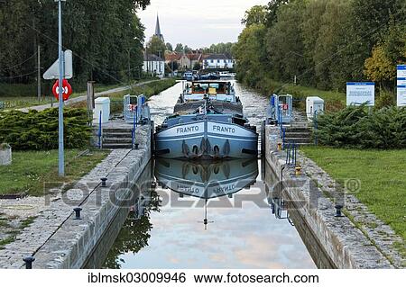 Stock Photograph - "Freighter Franto on the Canal des Vosges, formerly Canal de l'Est, last southern lock on the canal, lock No. 46, Corre, Vesoul, Haute-Saone, Franche-Comte, France, Europe". Fotosearch