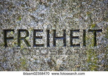 Stock Image - "Freiheit"""", German for """"Freedom"""", inscription on a memorial stone, VVN Monument, Union of Persecutees of the Nazi Regime? Çô Federation of Anti-Fascists, VVN-BdA e. V., Teltow, Brandenburg, Germany, Europe". Fotosearch