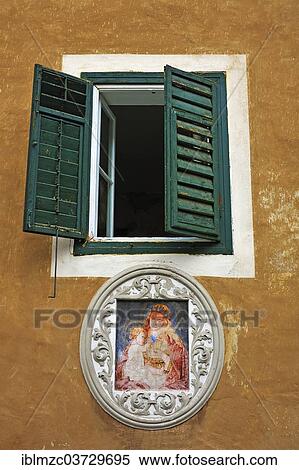 "Fresco of Saint Mary under a window with shutters on an old farmhouse, Berchtesgaden, Berchtesgadener Land District, Upper Bavaria, Bavaria, Germany, Europe" View Large Photo Image Stock Photography - "Fresco of Saint Mary under a window with shutters on an old farmhouse, Berchtesgaden, Berchtesgadener Land District, Upper Bavaria, Bavaria, Germany, Europe". Fotosearch