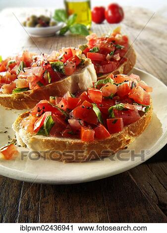 Fresh chopped beefsteak tomato bruschettas View Large Photo Image Stock Image - Fresh chopped beefsteak tomato bruschettas. Fotosearch