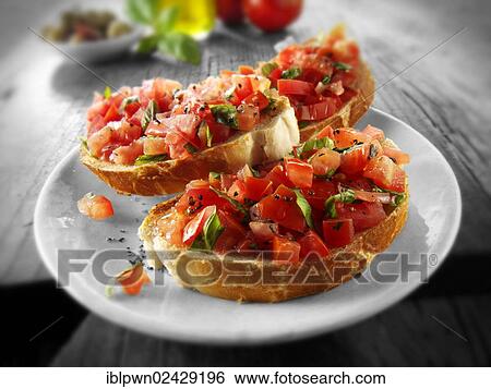 Fresh chopped beefsteak tomato bruschettas View Large Photo Image Stock Photograph - Fresh chopped beefsteak tomato bruschettas. Fotosearch