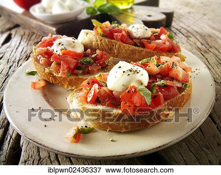 Fresh chopped beefsteak tomato with mini mozzarellas bruschettas View Large Photo Image Stock Photo - Fresh chopped beefsteak tomato with mini mozzarellas bruschettas. Fotosearch