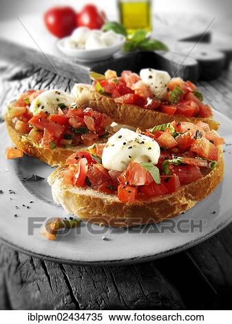 Fresh chopped beefsteak tomato with mini mozerellas bruschettas View Large Photo Image Stock Photography - Fresh chopped beefsteak tomato with mini mozerellas bruschettas. Fotosearch