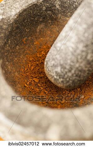 Fresh cinnamon being ground in a marble mortar View Large Photo Image Stock Image - Fresh cinnamon being ground in a marble mortar. Fotosearch