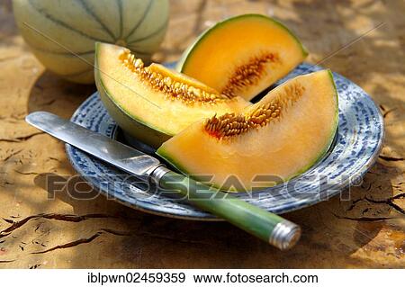 Fresh cut Charentais melon View Large Photo Image Stock Photo - Fresh cut Charentais melon. Fotosearch