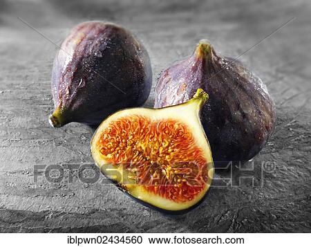 Stock Image - "Fresh figs, whole and cut". Fotosearch