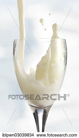 Picture - Fresh milk being poured into a glass. Fotosearch
