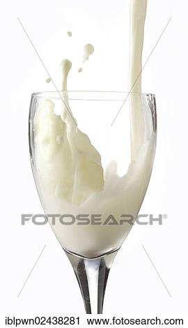 Stock Image - Fresh milk being poured into a glass. Fotosearch