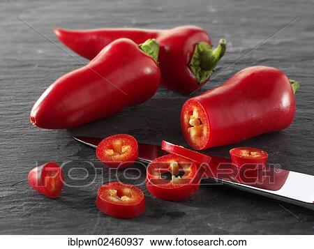 "Fresh red chilis, whole and cut" View Large Photo Image Stock Photo - "Fresh red chilis, whole and cut". Fotosearch