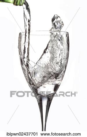Stock Image - Fresh water being poured into a glass. Fotosearch