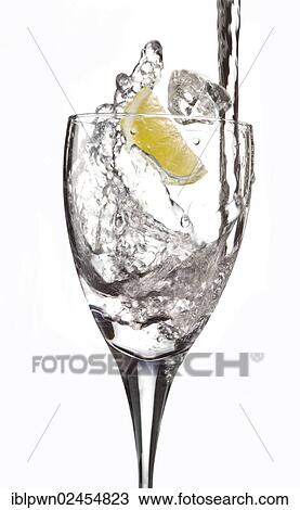 Stock Image - Fresh water being poured into a glass. Fotosearch