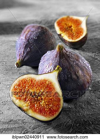 Stock Image - Fresh whole and cut figs. Fotosearch