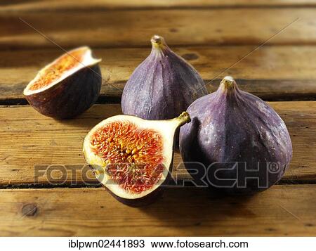 Stock Image - Fresh whole and cut figs. Fotosearch