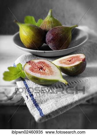 Stock Photography - Fresh whole and cut figs. Fotosearch
