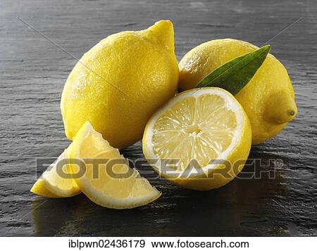 Fresh whole and cut lemons View Large Photo Image Stock Photo - Fresh whole and cut lemons. Fotosearch