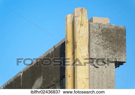 "Freshly built brick wall against a blue sky, Grevenbroich, North Rhine-Westphalia, Germany, Europe" View Large Photo Image Stock Photo - "Freshly built brick wall against a blue sky, Grevenbroich, North Rhine-Westphalia, Germany, Europe". Fotosearch