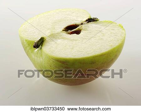 Freshly cut half of a Bramley apple View Large Photo Image Stock Image - Freshly cut half of a Bramley apple. Fotosearch