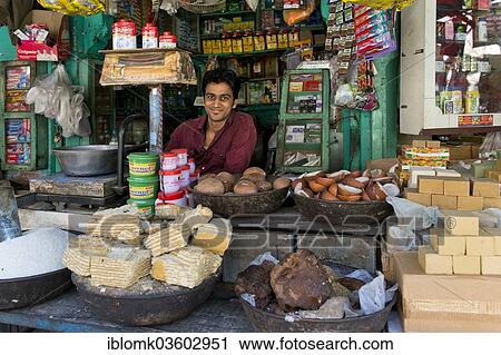 Stock Image - "Friendly-looking grocer at the market, Jodhpur, Rajasthan, India, Asia". Fotosearch