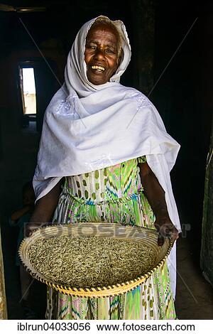 "Friendly old woman standing with a basket of corn, near Keren, Eritrea, Africa" View Large Photo Image Stock Photograph - "Friendly old woman standing with a basket of corn, near Keren, Eritrea, Africa". Fotosearch