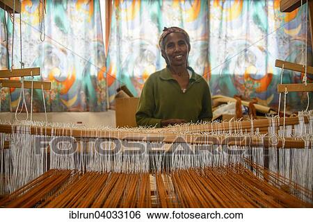 "Friendly woman working on a hand weaving loom on social project, Eritrea, Africa" View Large Photo Image Stock Photograph - "Friendly woman working on a hand weaving loom on social project, Eritrea, Africa". Fotosearch