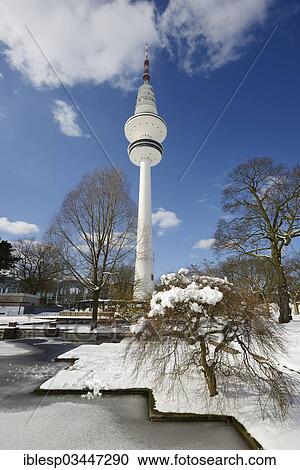 Stock Image - "Frozen ponds in """"Planten un Blomen"""" park, Heinrich Hertz Tower at the rear, Hamburg, Hamburg, Germany, Europe". Fotosearch
