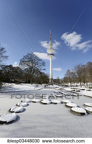 "Frozen ponds in """"Planten un Blomen"""" park, Heinrich Hertz Tower at the rear, Hamburg, Hamburg, Germany, Europe" View Large Photo Image Stock Image - "Frozen ponds in """"Planten un Blomen"""" park, Heinrich Hertz Tower at the rear, Hamburg, Hamburg, Germany, Europe". Fotosearch