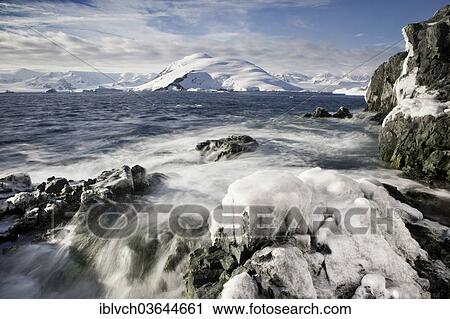 Stock Image - "Frozen rocks, coast, Antarctic Peninsula, Antarctica". Fotosearch