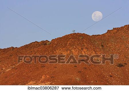 "Full moon over the reddish rocks in the Goantagab-Rivier, Damaraland, Namibia, Africa" View Large Photo Image Stock Photo - "Full moon over the reddish rocks in the Goantagab-Rivier, Damaraland, Namibia, Africa". Fotosearch