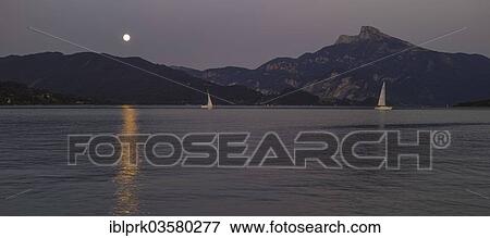 "Full moon rising over lake Mondsee, Schafberg mountain at the back, Mondsee, Upper Austria, Austria, Europe" View Large Photo Image Stock Photo - "Full moon rising over lake Mondsee, Schafberg mountain at the back, Mondsee, Upper Austria, Austria, Europe". Fotosearch