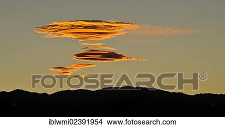 Picture - "Fully formed Sierra Wave Clouds, evening light above the Panamint Range, Zabriskie Point or Zabriske Point, Death Valley National Park, Mojave Desert, California, USA". Fotosearch