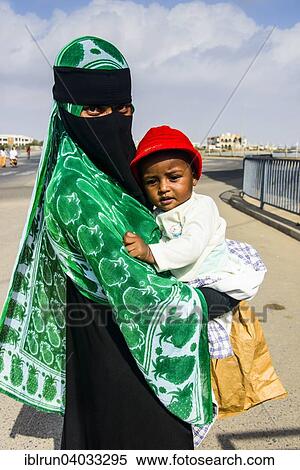 Stock Photography - "Fully veiled Muslim woman and her child, Massawa, Eritrea, Africa". Fotosearch