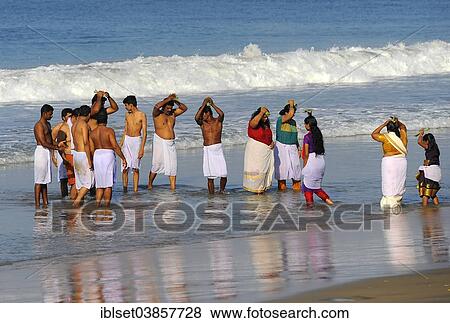 Stock Photo - "Funeral ceremony on the beach, Arabian Sea, Varkala, Kerala, South India, India, Asia". Fotosearch