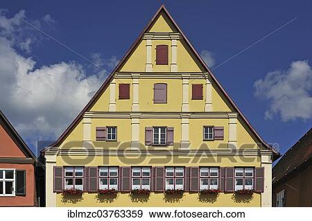 "Gable of an old patrician house, gabled building with a pitched roof and Baroque plaster divisions, from 1541, newer construction from 17-18th century, Dinkelsbuhl, Middle Franconia, Bavaria, Germany, Europe" View Large Photo Image Stock Photo - "Gable of an old patrician house, gabled building with a pitched roof and Baroque plaster divisions, from 1541, newer construction from 17-18th century, Dinkelsbuhl, Middle Franconia, Bavaria, Germany, Europe". Fotosearch