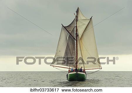 "Gaff-rigged schooner with the sails in the butterfly position, Baltic Sea, Mecklenburg-Western Pomerania, Germany, Europe" View Large Photo Image Stock Photo - "Gaff-rigged schooner with the sails in the butterfly position, Baltic Sea, Mecklenburg-Western Pomerania, Germany, Europe". Fotosearch