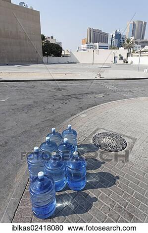 Gallons of water for a water dispenser, placed on the roadside, Dubai, United Arab Emirates, Middle East, Asia View Large Photo Image Stock Image - Gallons of water for a water dispenser, placed on the roadside, Dubai, United Arab Emirates, Middle East, Asia. Fotosearch