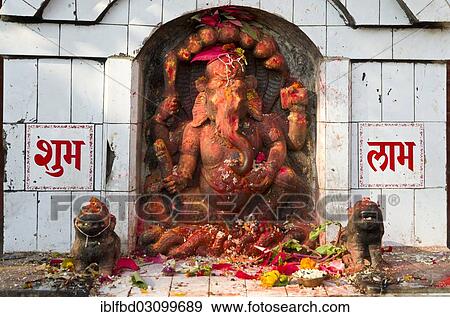 Stock Photo - "Ganesha shrine with some offerings, Kathmandu, Kathmandu District, Bagmati Zone, Nepal, Asia". Fotosearch