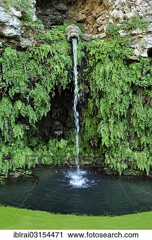 Stock Image - "Gargoyle at the grotto of the water source, Fontana del Diluvio, flood fountain, garden of Villa Lante, Bagnaia, Lazio, Italy, Europe". Fotosearch