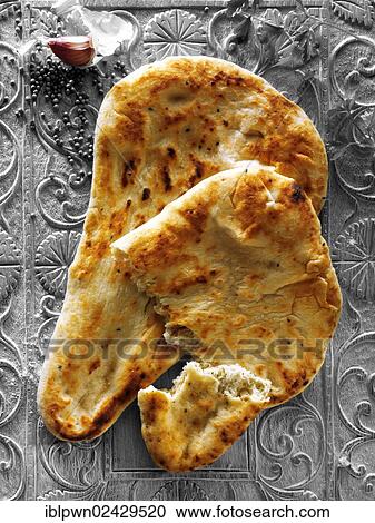Garlic and coriander Indian Naan bread View Large Photo Image Stock Image - Garlic and coriander Indian Naan bread. Fotosearch
