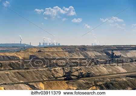 Stock Photo - "Garzweiler open-cast mine, the power plants of Frimmersdorf and Neurath at the back, Grevenbroich, North Rhine-Westphalia, Germany, Europe". Fotosearch