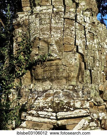 Stock Image - "Gate tower with a stone face on the western gate, Ta Phrom temple complex, Angkor, Siem Reap, Siem Reap Province, Cambodia, Asia". Fotosearch