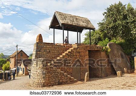 Stock Photograph - "Gate with round stone door, former Royal Palace Rova, Ambohimanga Royal Hill, UNESCO World Heritage Site, Madagascar, Africa". Fotosearch