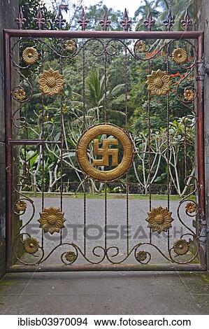 "Gate with swastika, symbol of good luck in Hinduism, at Tirta Empul Water Temple, Bali, Indonesia, Asia" View Large Photo Image Picture - "Gate with swastika, symbol of good luck in Hinduism, at Tirta Empul Water Temple, Bali, Indonesia, Asia". Fotosearch