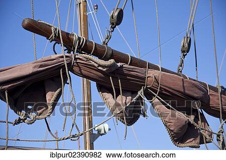 "Gathered sail of a small sailing ship in the harbour of Greifswald, Mecklenburg-Western Pomerania, Germany, Europe" View Large Photo Image Stock Image - "Gathered sail of a small sailing ship in the harbour of Greifswald, Mecklenburg-Western Pomerania, Germany, Europe". Fotosearch