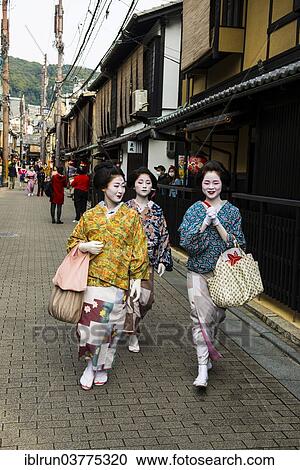 Stock Image - "Geishas walking in the Geisha quarter Gion, Kyoto, Japan, Asia". Fotosearch