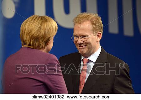 Stock Image - "German Chancellor Angela Merkel, CDU, greeting Sebastian Turner, candidate for mayor, Stuttgart, Baden-Wuerttemberg, Germany, Europe, PublicGround, Europe". Fotosearch