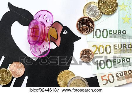 Stock Photo - "German federal eagle with pacifier, euro coins and banknotes, symbolic image for child care subsidies". Fotosearch