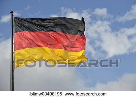 "German flag against a blue sky with clouds, Berlin, Berlin, Germany, Europe" View Large Photo Image Stock Photography - "German flag against a blue sky with clouds, Berlin, Berlin, Germany, Europe". Fotosearch